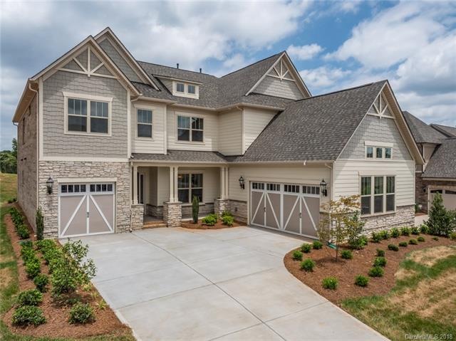 Stunning front elevation boasts stone and hardi si