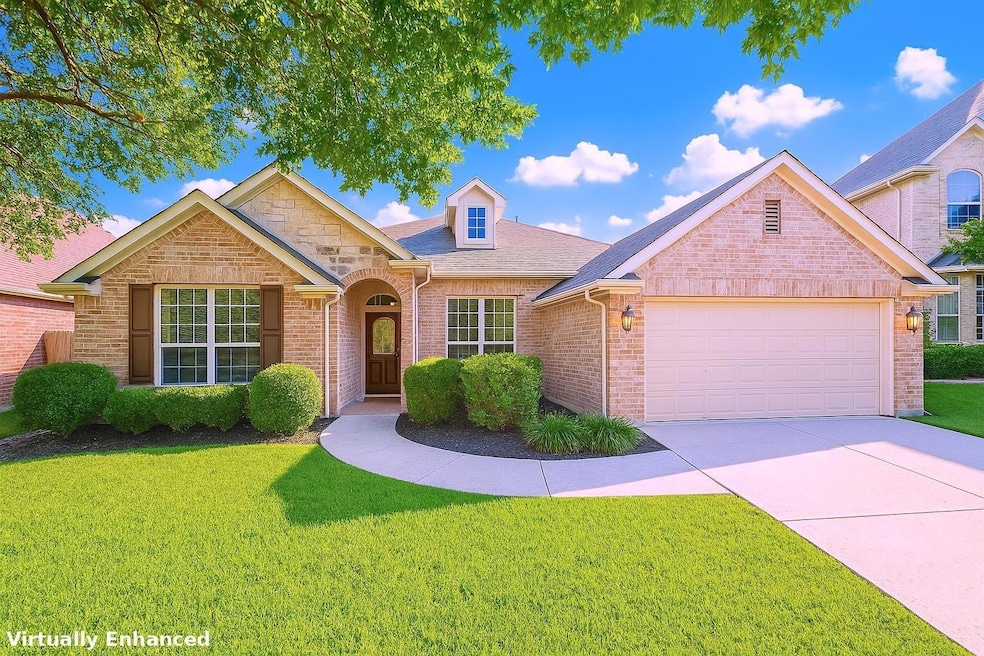 Traditional home featuring a front lawn, an attac