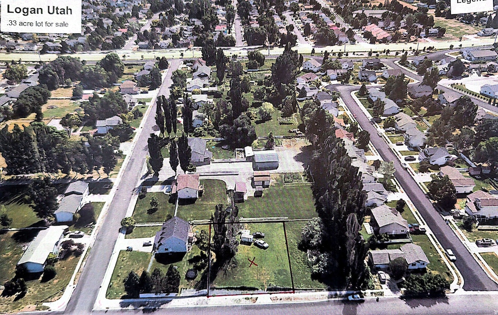 Aerial view of property's location featuring nearby suburban area