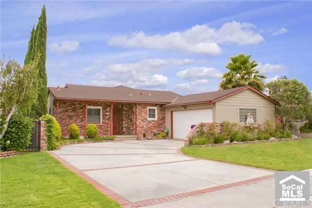 Home offers gorgeous brick work and curb appeal