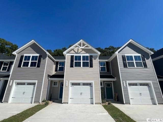 View of property featuring a garage