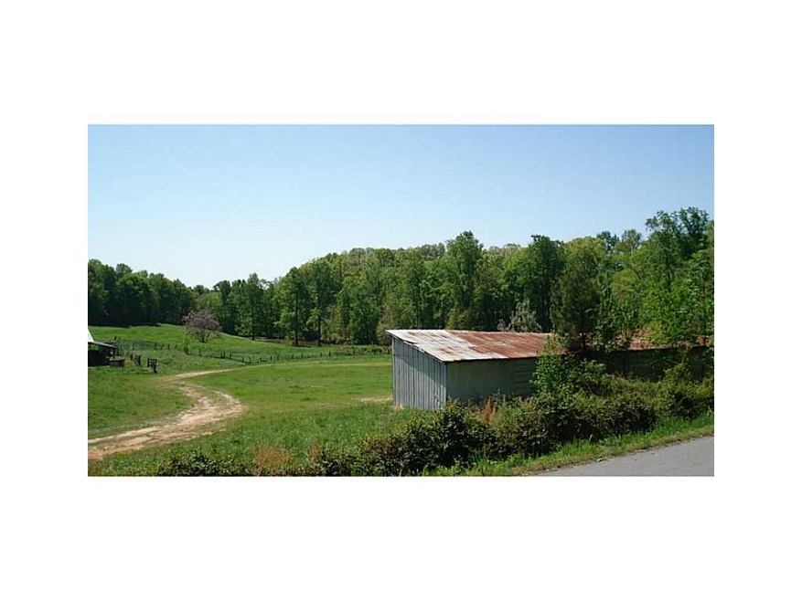 Exterior Front. 5.75 acres with spring fed stream