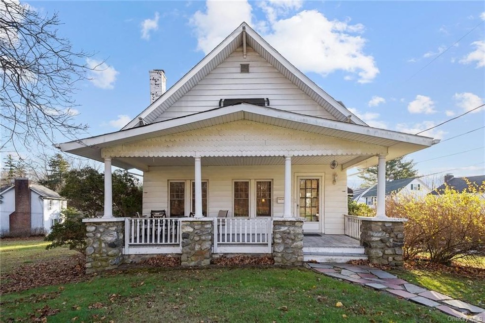 Front view of the two family house with large fron