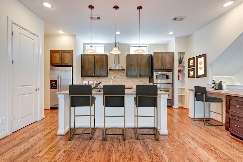 Gorgeous hardwood floors flows through out the kitchen