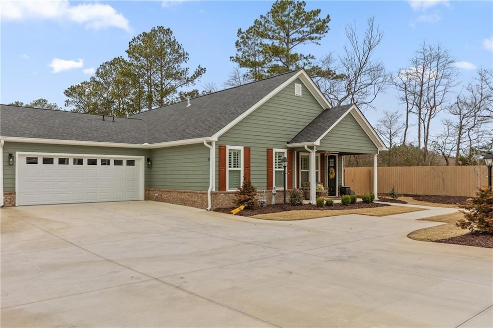 View of front of house with brick siding, a shingl
