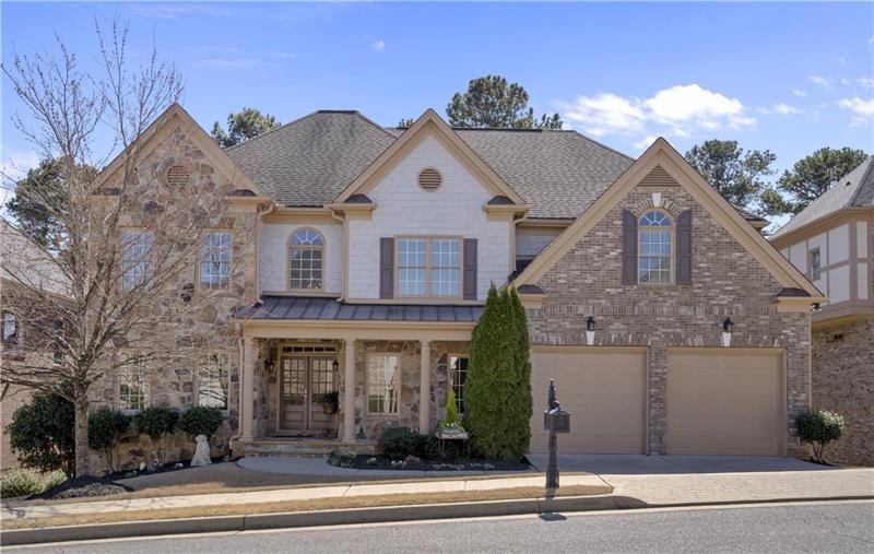 Welcome home! Beautifully detailed with stone, bri