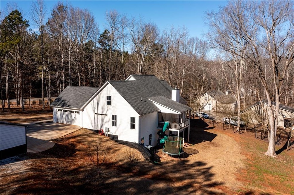 View of side of home with a garage