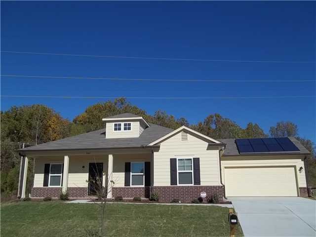 Front view with solar panels.