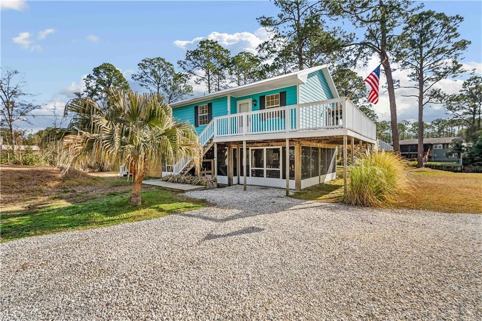 View of front of property featuring a sunroom