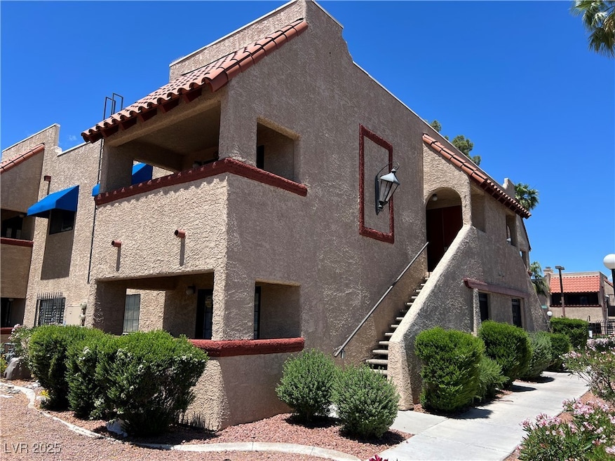 View of side of property featuring stucco siding a