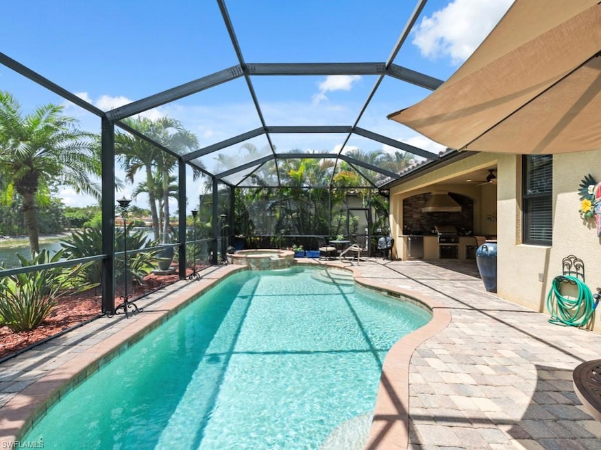 View of swimming pool with a patio, a lanai, a poo