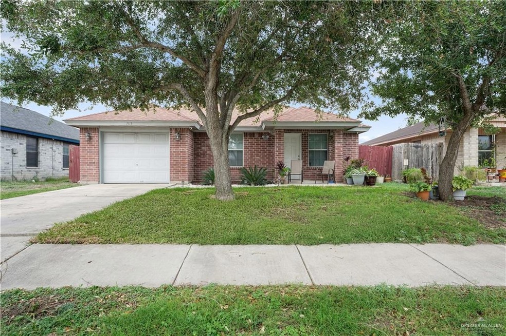 Ranch-style house with brick siding, concrete driveway, and an attached garage