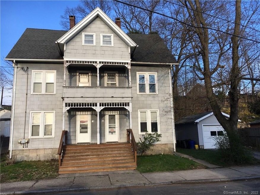 Large duplex with walk up attic. Detached one car 