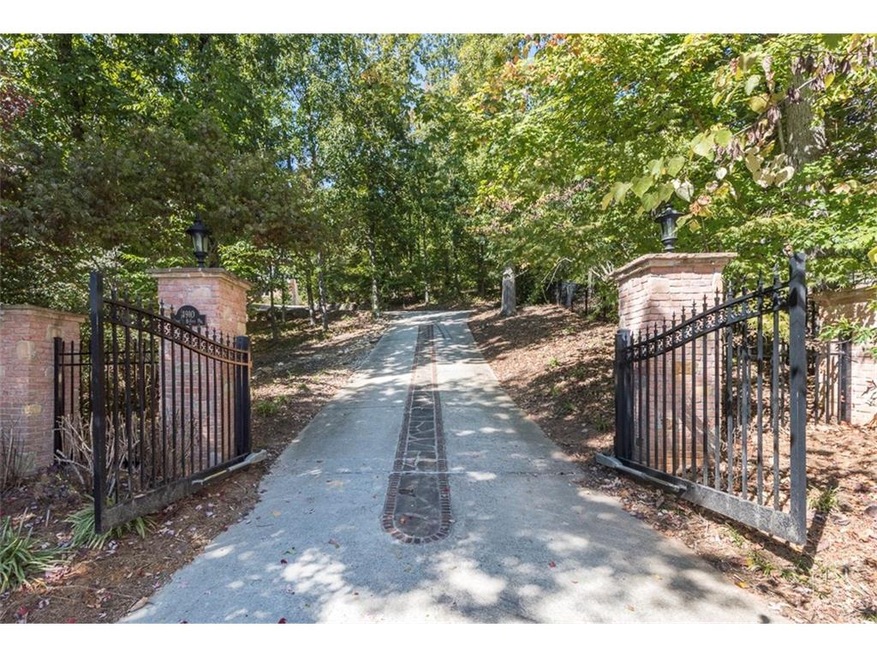 Gated entrance to private retreat nestled in a cul