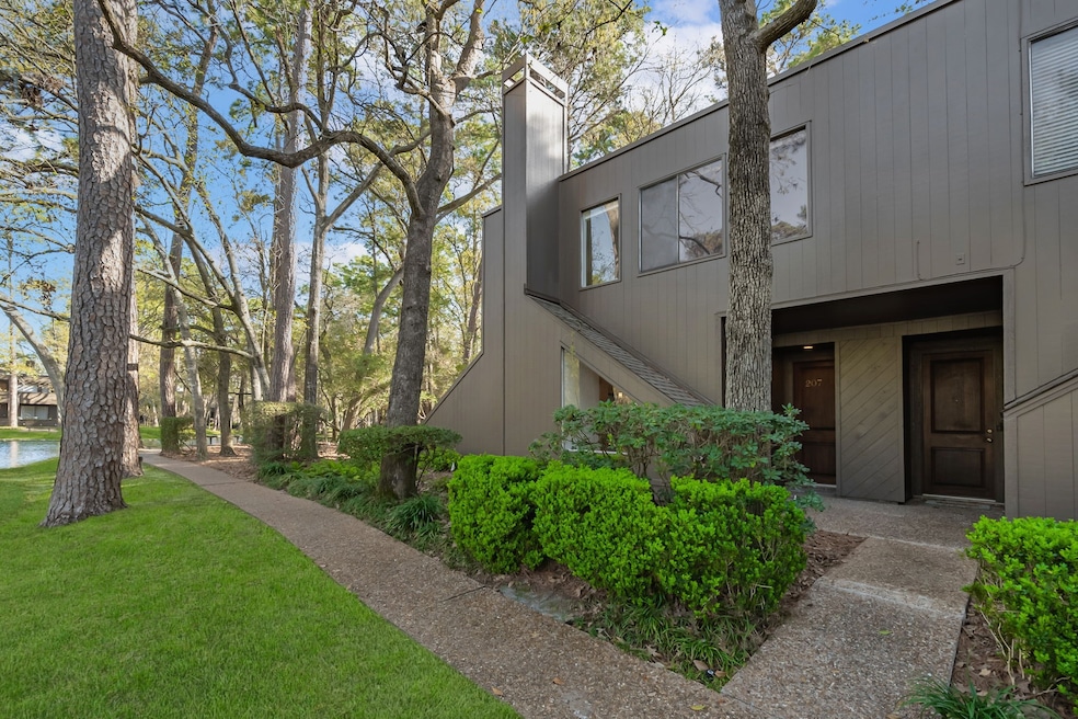 Modern, two-story home nestled among mature trees