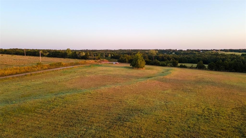 Yard at dusk with a rural view