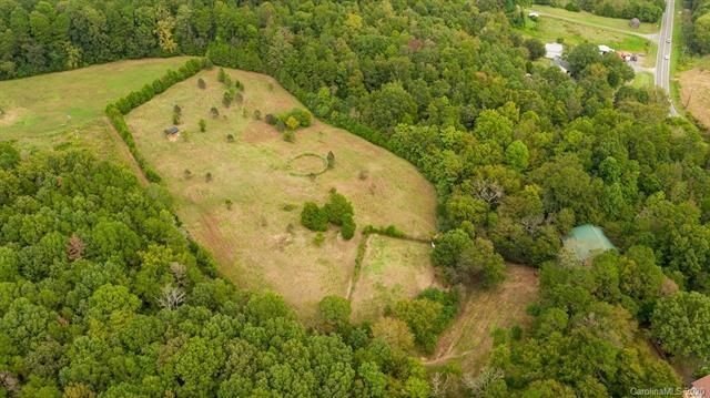 Gorgeous land. 9.76 acres with a house, barn, meta