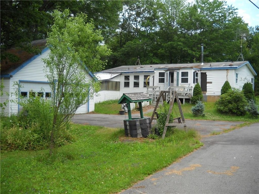 Back of house with added enclosed...