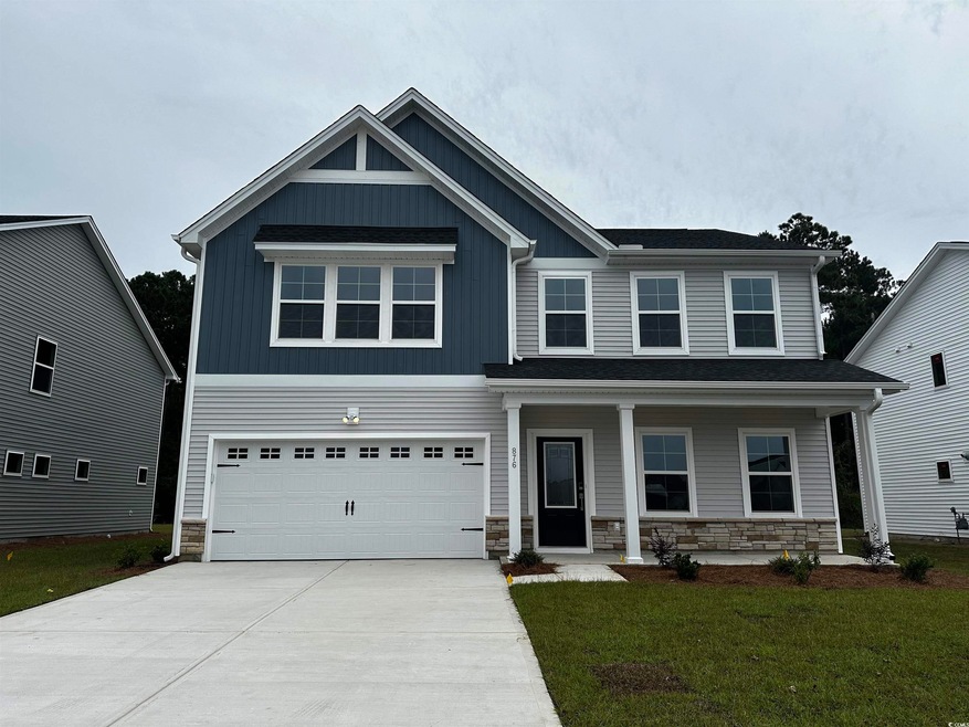 Craftsman-style home with a garage, a porch, and a