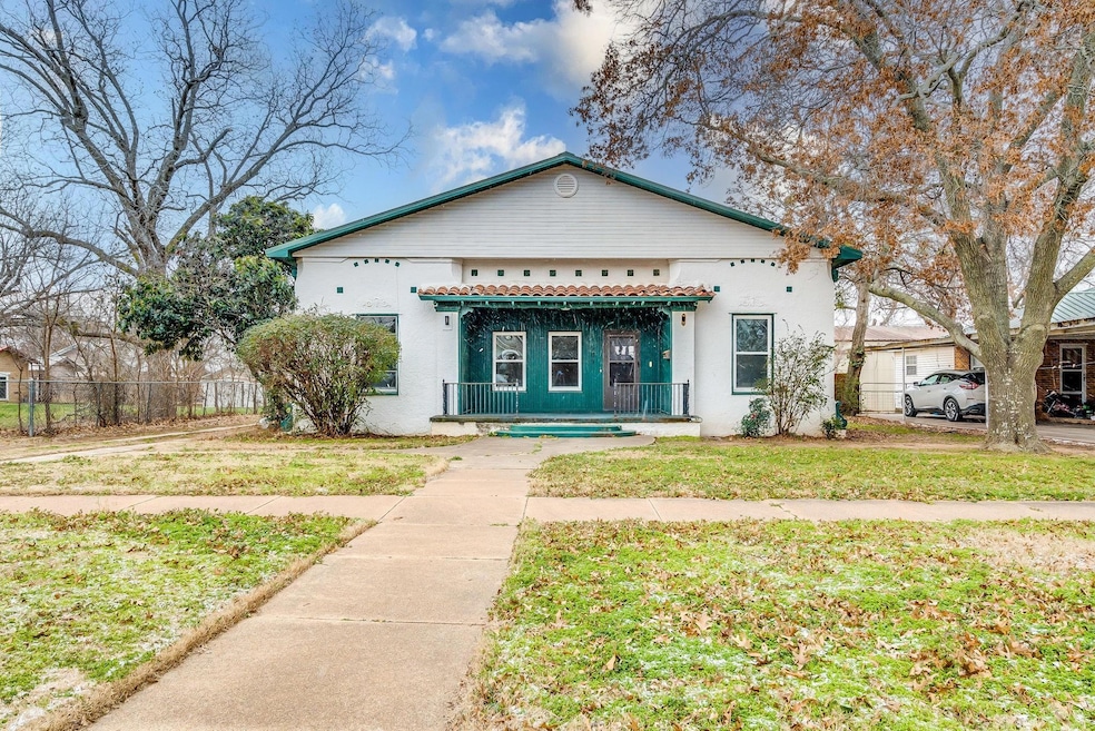 Bungalow-style home with covered porch, fence, a f