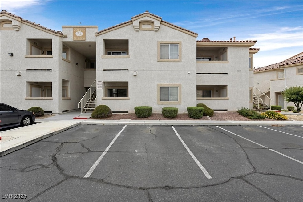 View of property featuring stairs and uncovered pa