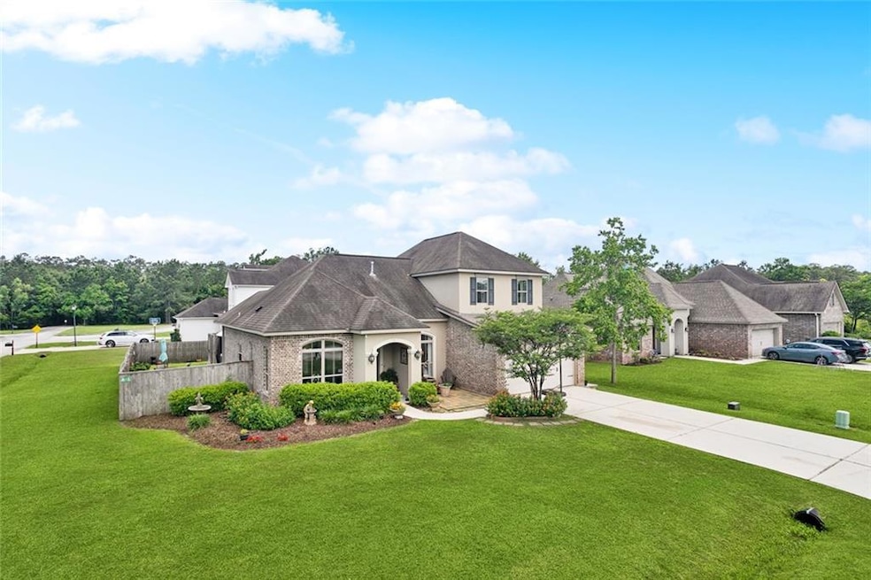 Situated on a corner lot in popular, gated communi