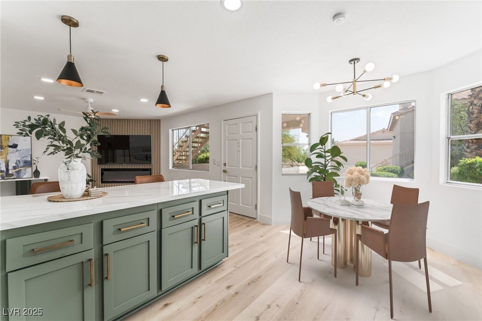 Kitchen with green cabinets, baseboards, hanging l
