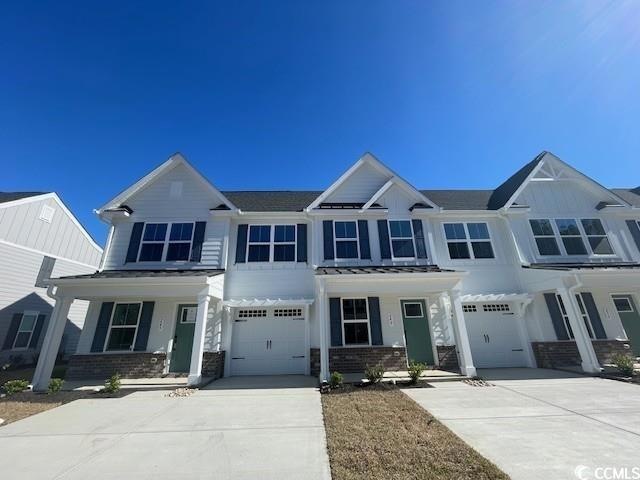 View of front facade featuring an attached garage,
