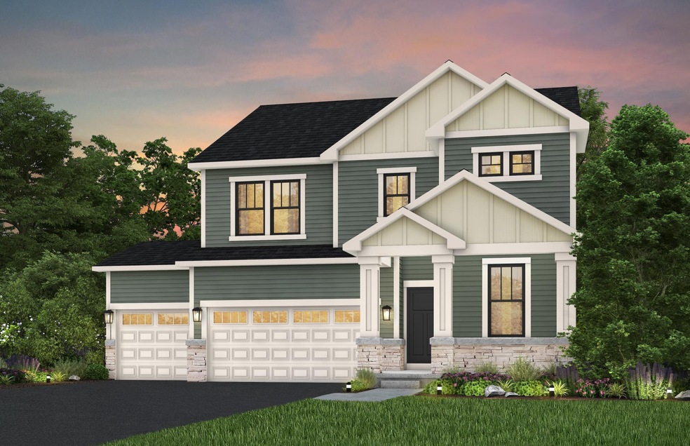 Smooth, clean walkways guide visitors to the front door, bordered by tasteful landscaping that enhances the home’s inviting exterior