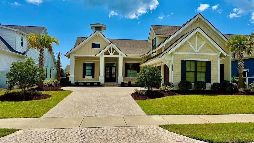View of building exterior with concrete driveway