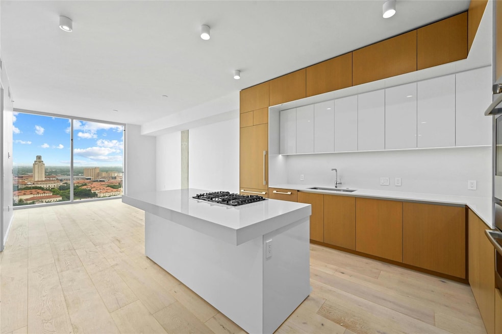 Kitchen with modern cabinets, light wood-style fl