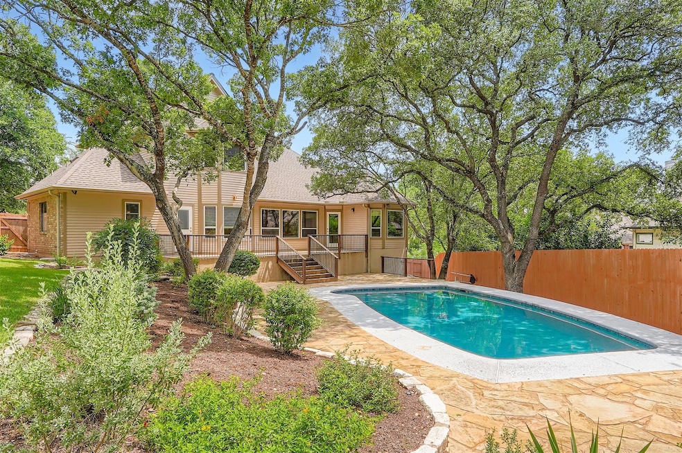 View of pool with a deck and a fenced backyard