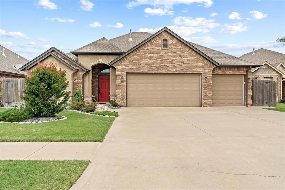 French provincial home with an attached garage, concrete driveway, roof with shingles, and brick siding