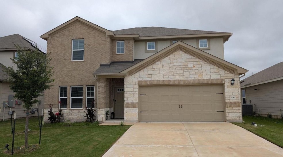 View of front of home with stone siding, a front 