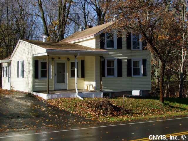 Exterior Front Cute Farm House with maintenance fr