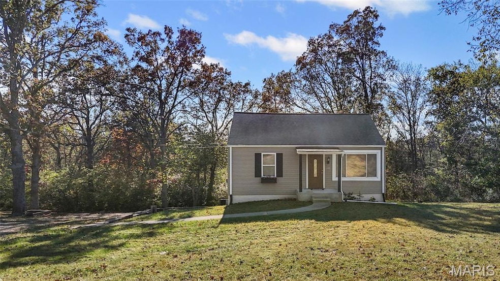 View of front of property with a front lawn