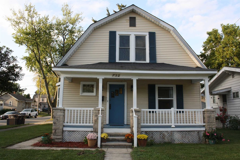 Unique gambrel roof with covered front porch
