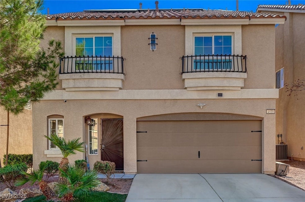 View of front facade featuring a balcony, stucco s