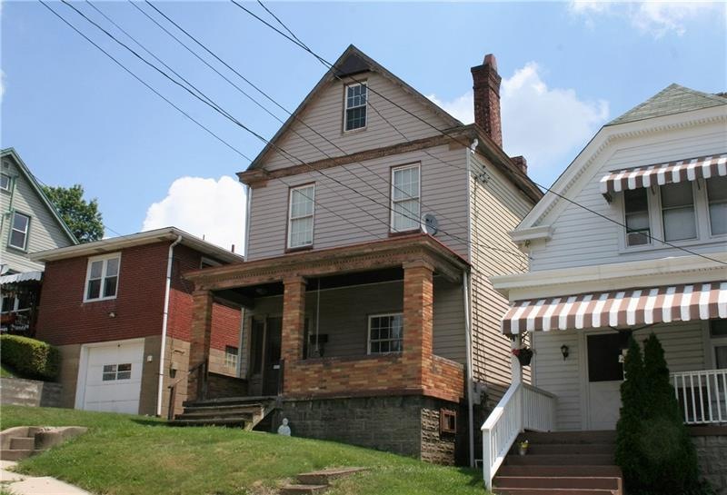 Expansive front porch provides plenty of space for