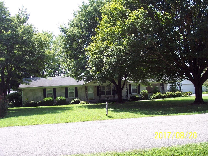 All brick ranch style home w/ 2 car detached garage