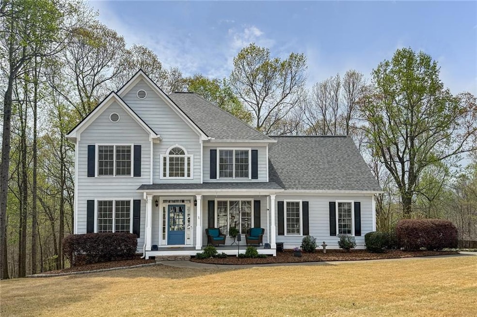 Charming front of home with covered porch, NEW roo