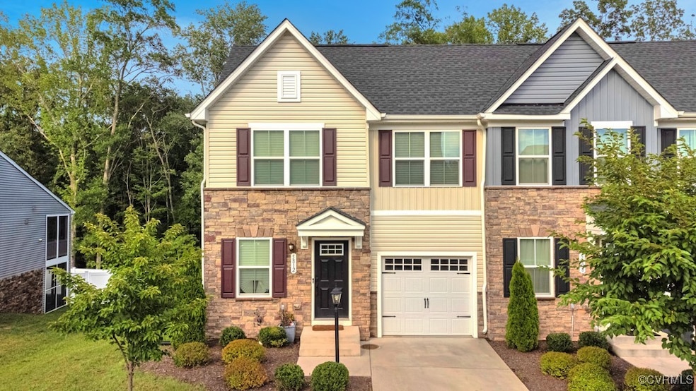 Traditional-style house featuring stone siding, dr