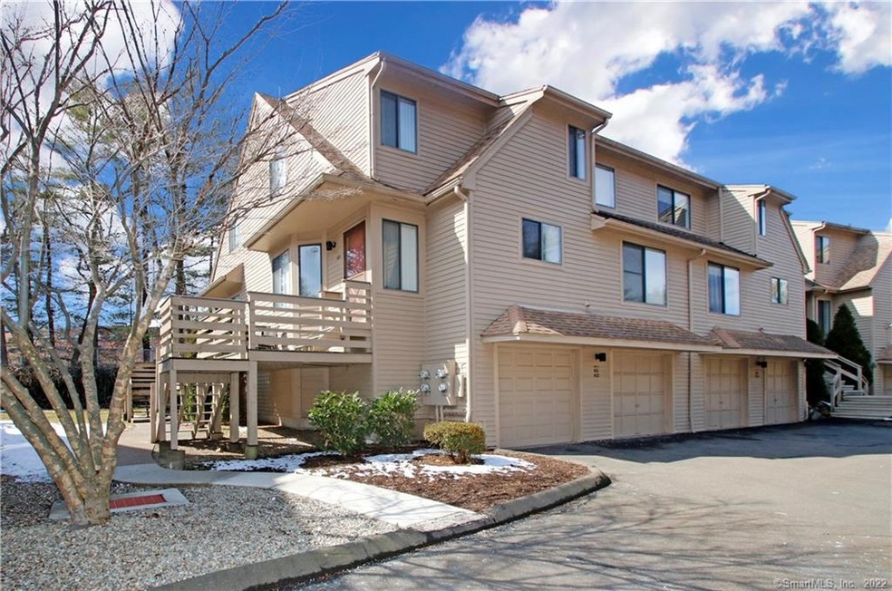 Exterior front with 1 car garage. End unit.
