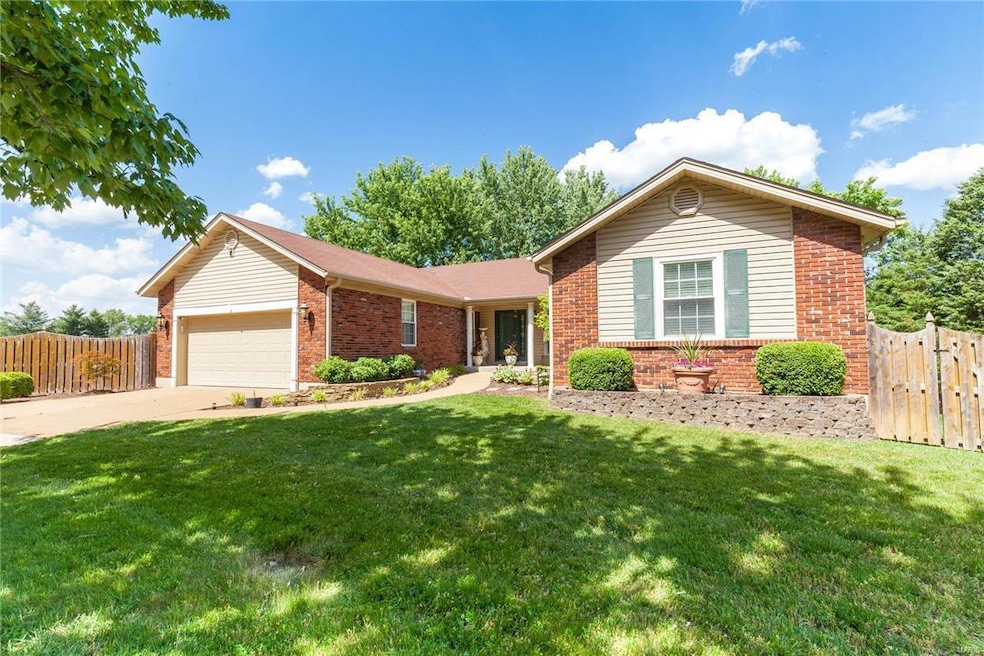 This charming ranch is nestled in a cul-de-sac and sits on almost a half acre.