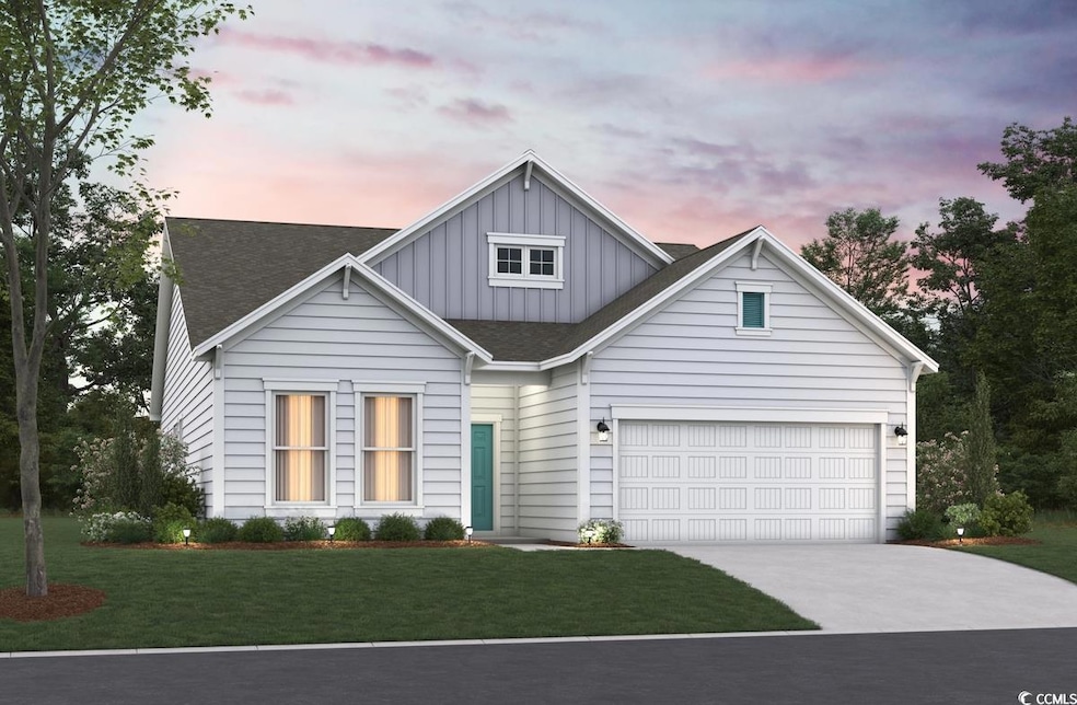 View of front of house featuring board and batten siding, driveway, a front yard, and roof with shingles