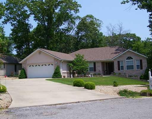 Exterior Front. Great curb appeal with long curved driveway