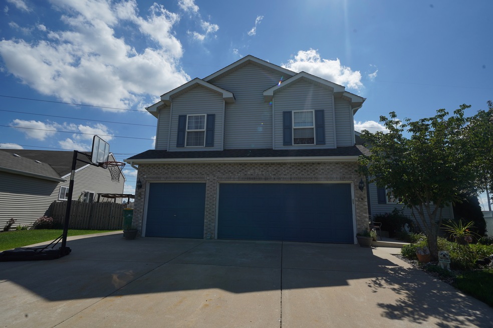 Three Car Garage w/Concrete Driveway