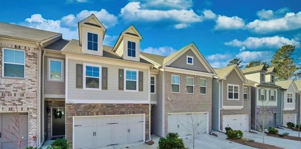 Multi unit property with a garage and concrete driveway