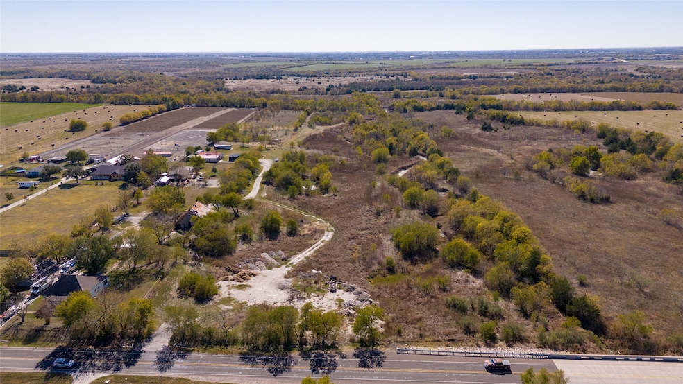 Aerial overview of property's location with rural landscape