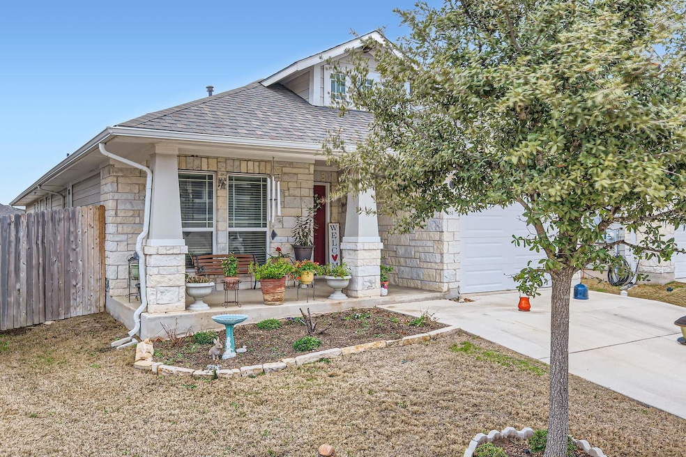 View of front of property with a shingled roof, c